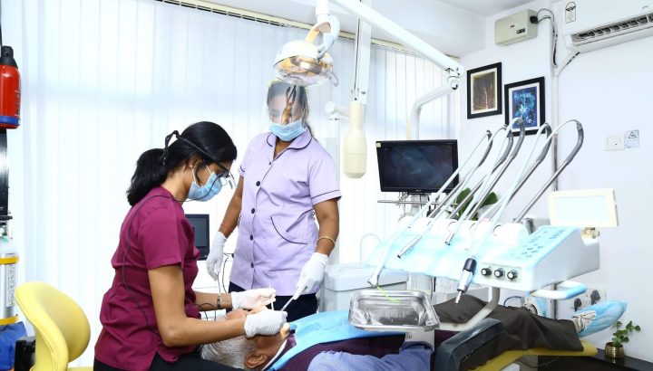 Dr. Shailaja giving treatment to dental patient